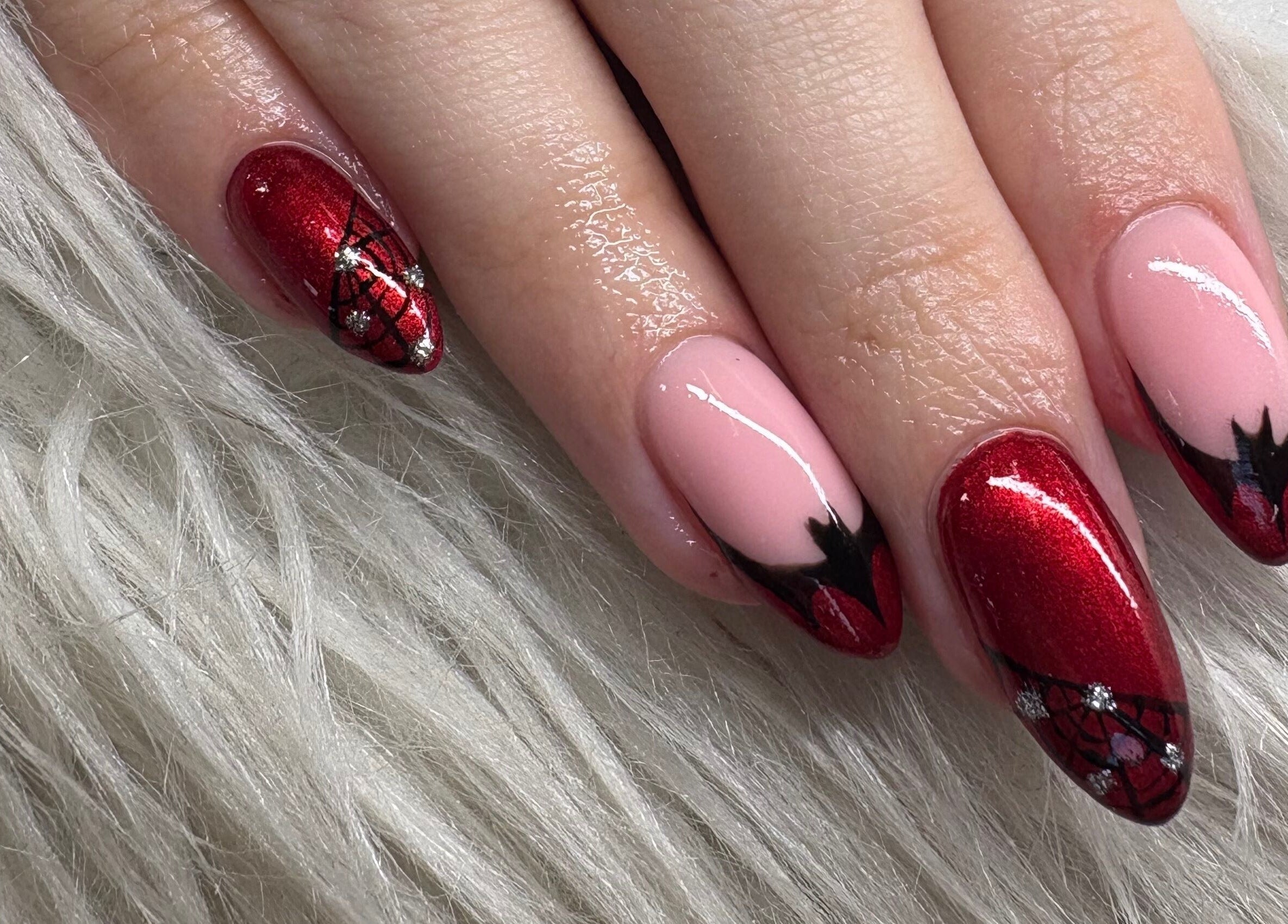 Elegant red and black nail art at Haus of Pixiee, Pontyclun, Wales, GB.