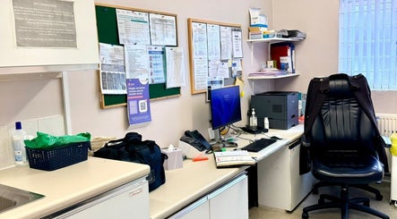 Office corner at Shannaz Aesthetics, Luton, England, GB with desk, chair, and bulletin board.