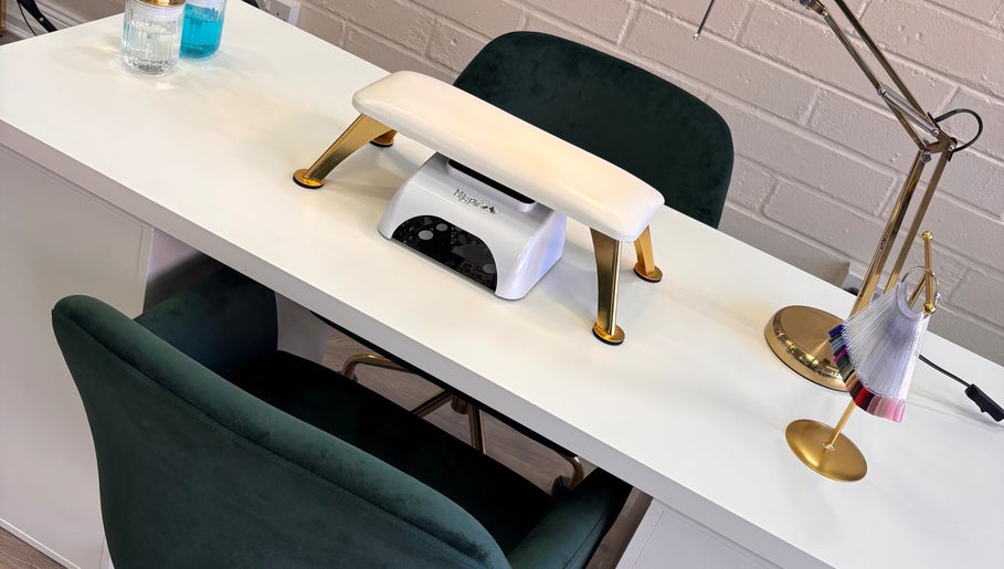 Elegant nail station setup at Lani by Kelly Carpenter, Mullingar, County Westmeath, IE featuring plush seating.