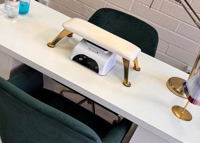 Elegant nail station setup at Lani by Kelly Carpenter, Mullingar, County Westmeath, IE featuring plush seating.