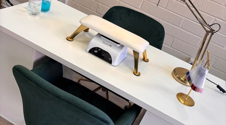 Elegant nail station setup at Lani by Kelly Carpenter, Mullingar, County Westmeath, IE featuring plush seating.