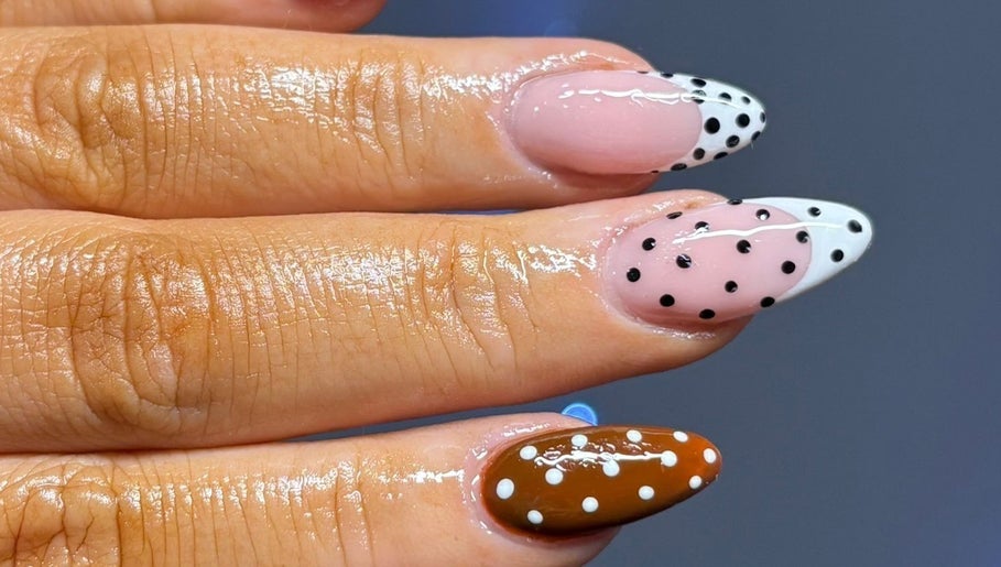 Polka dot nail art at Flawless Moments, North Shields, England, GB. Trendy design with glossy finish.