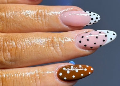 Polka dot nail art at Flawless Moments, North Shields, England, GB. Trendy design with glossy finish.