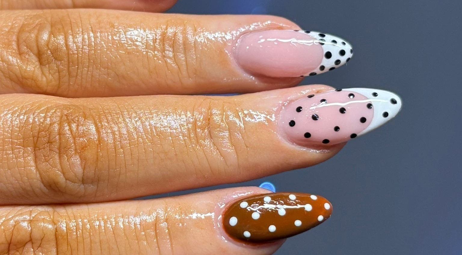 Polka dot nail art at Flawless Moments, North Shields, England, GB. Trendy design with glossy finish.