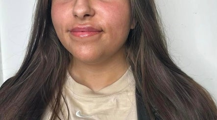 Close-up of a woman's glowing skin after treatment at Flawless Moments, North Shields, England, GB.