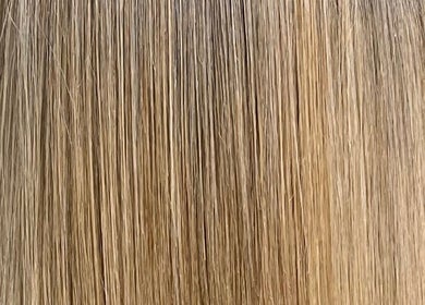 Close-up of golden blonde hair styled at Emily hairstylz, Cape Town, Western Cape, ZA.