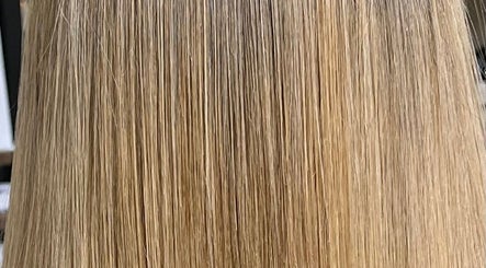 Close-up of golden blonde hair styled at Emily hairstylz, Cape Town, Western Cape, ZA.