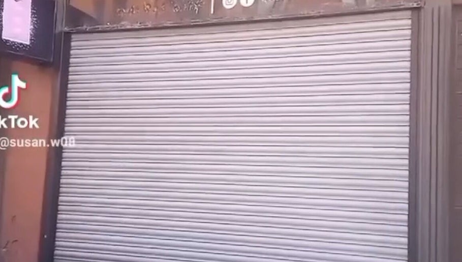 Exterior view of Hair By Sarah in Glasgow, Scotland, GB with its shutter closed.