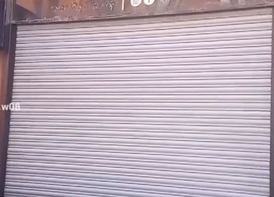 Exterior view of Hair By Sarah in Glasgow, Scotland, GB with its shutter closed.