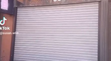 Exterior view of Hair By Sarah in Glasgow, Scotland, GB with its shutter closed.