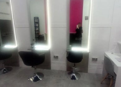 Modern salon mirrors and chairs at Hair By Sarah, Glasgow, Scotland, GB.