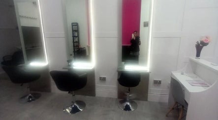 Modern salon mirrors and chairs at Hair By Sarah, Glasgow, Scotland, GB.