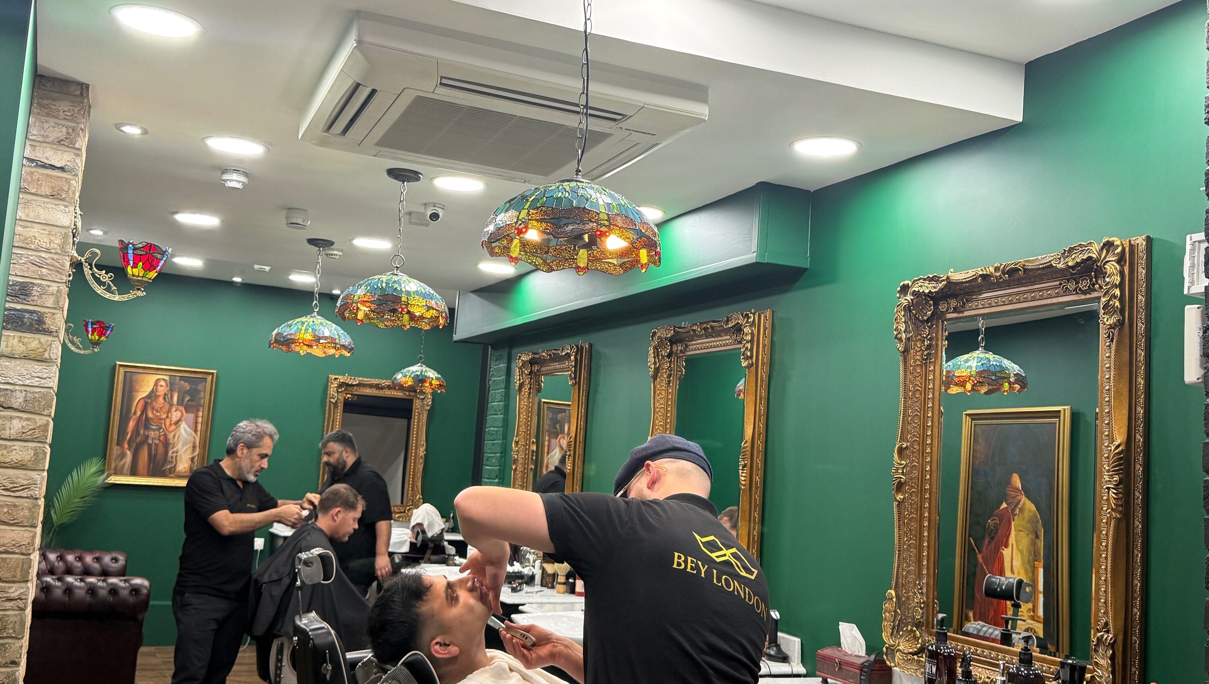 Bey London barbers providing grooming services in a stylish salon, London, England, GB.