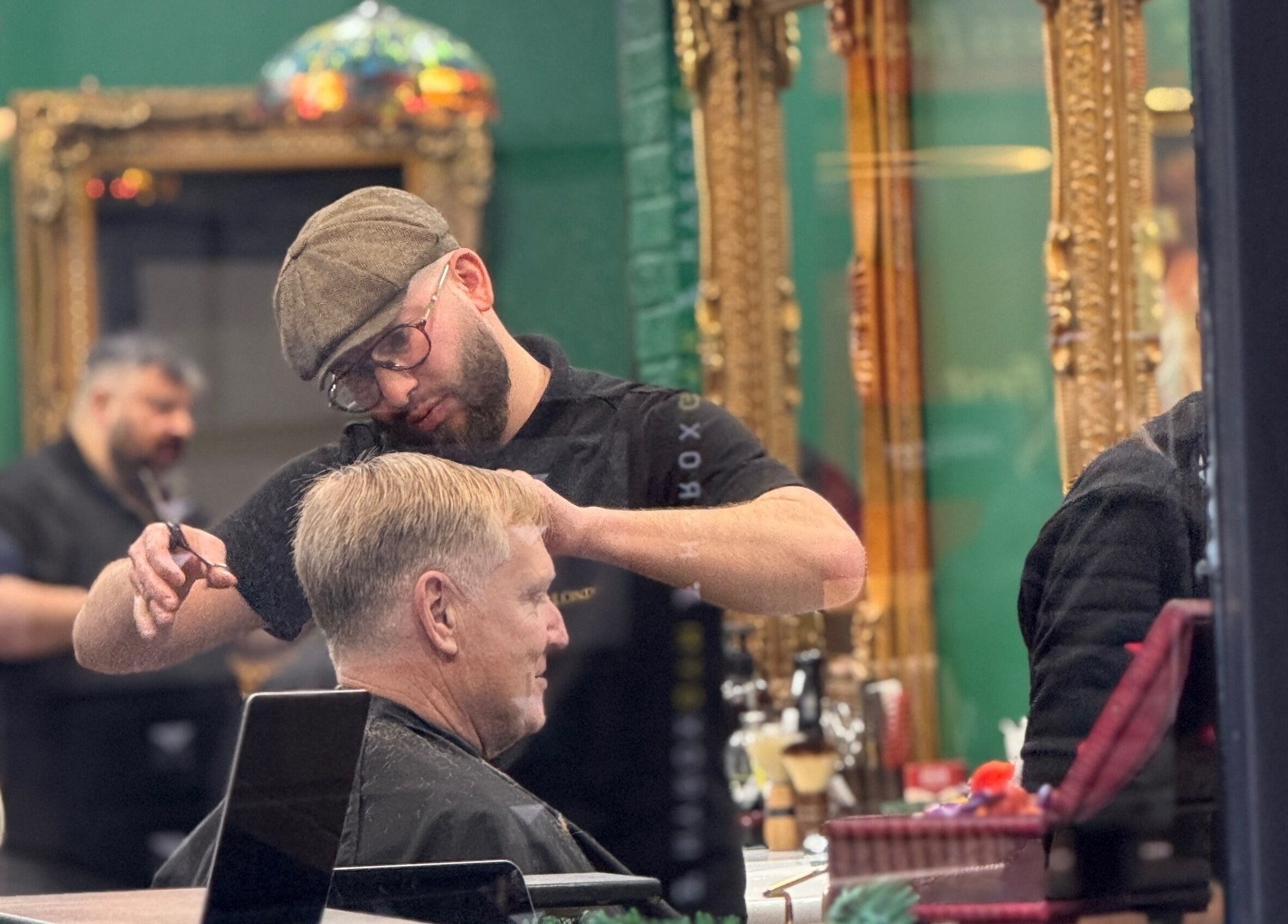 Hairdresser styling at Bey London in London, England, GB, showcasing a classic grooming service.