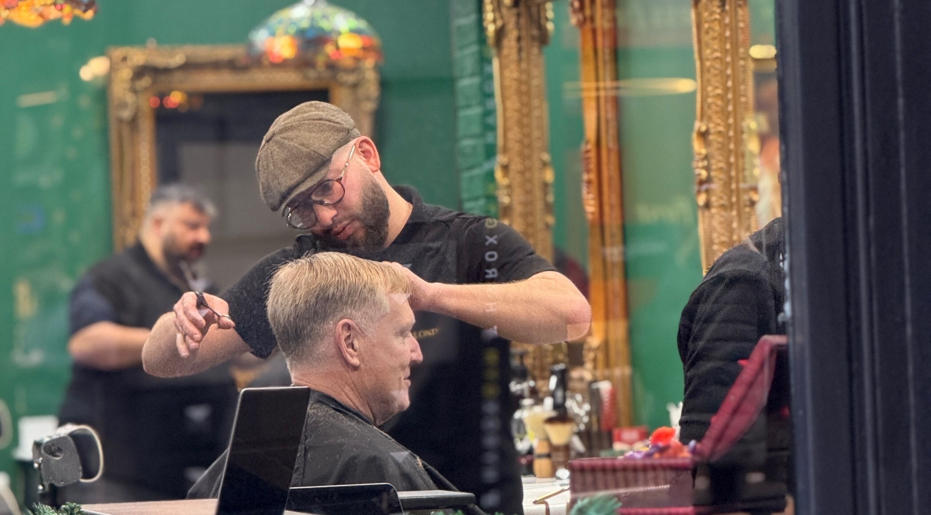 Hairdresser styling at Bey London in London, England, GB, showcasing a classic grooming service.