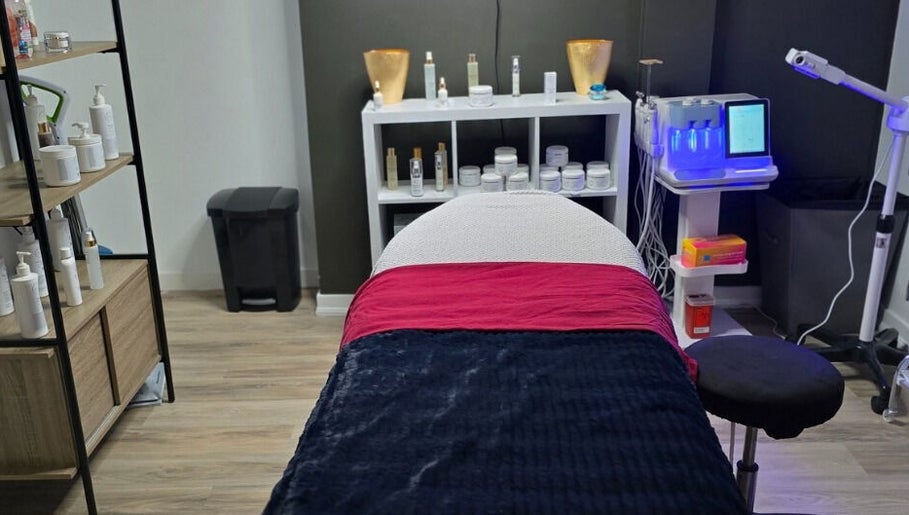 Treatment room at Beauty & Body Sugaring Sarnia, Sarnia, Ontario, CA, featuring cozy bed and skincare products.