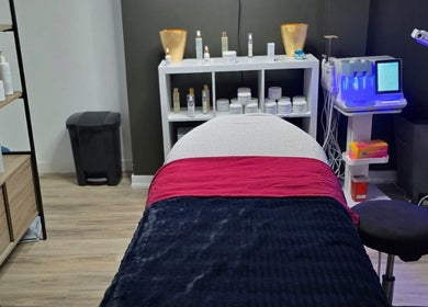 Treatment room at Beauty & Body Sugaring Sarnia, Sarnia, Ontario, CA, featuring cozy bed and skincare products.