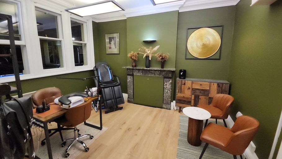 Luxurious therapy room in Tati Beauty, Manchester, England, GB with chic decor and comfortable seating.