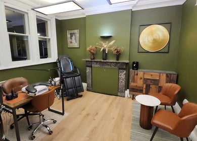 Luxurious therapy room in Tati Beauty, Manchester, England, GB with chic decor and comfortable seating.