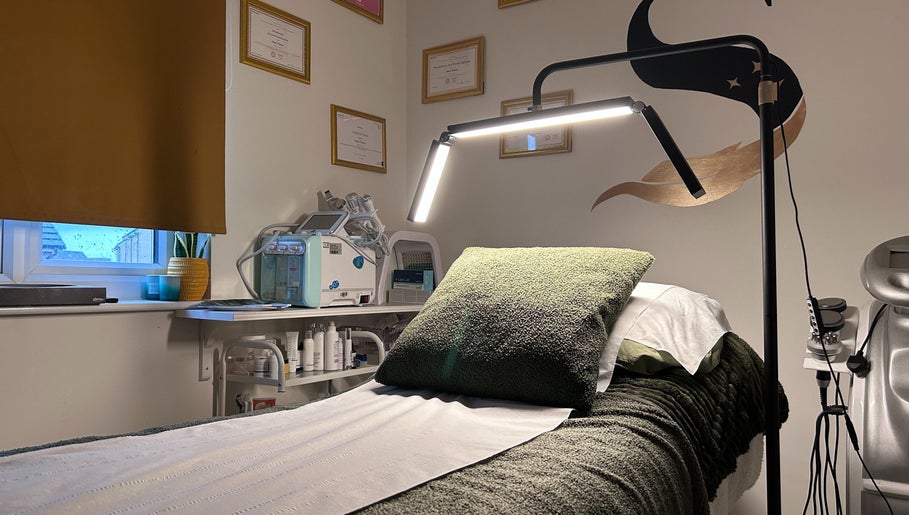 Relaxing treatment room at SWEY Aesthetics, Milton Keynes, England, GB, with a soft-lit ambiance.