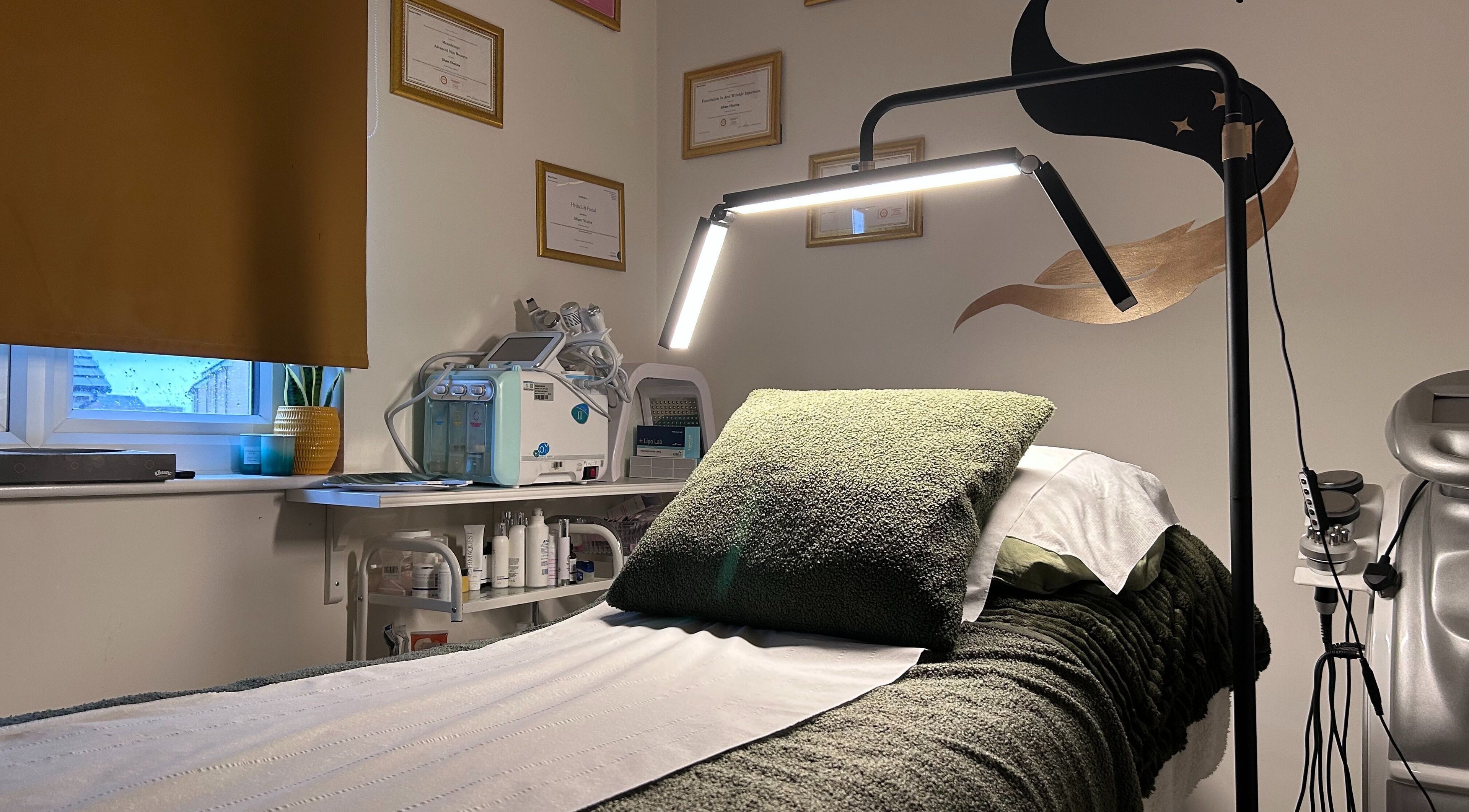 Relaxing treatment room at SWEY Aesthetics, Milton Keynes, England, GB, with a soft-lit ambiance.