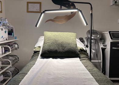 Relaxing treatment room at SWEY Aesthetics, Milton Keynes, England, GB featuring advanced skincare equipment.