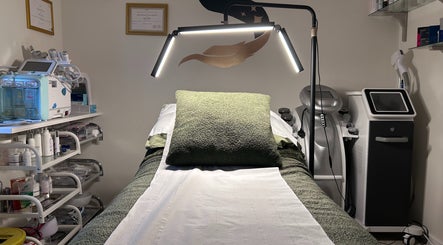 Relaxing treatment room at SWEY Aesthetics, Milton Keynes, England, GB featuring advanced skincare equipment.