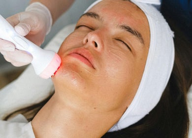 A client receives a facial treatment at SWEY Aesthetics, Milton Keynes, England, GB, enhancing skin radiance.
