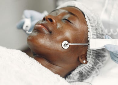 Facial treatment in progress at SWEY Aesthetics, Milton Keynes, England, GB using advanced skincare techniques.