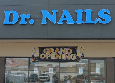 Front view of Dr. Nails Georgetown at Halton Hills, Ontario, CA, with grand opening banner.