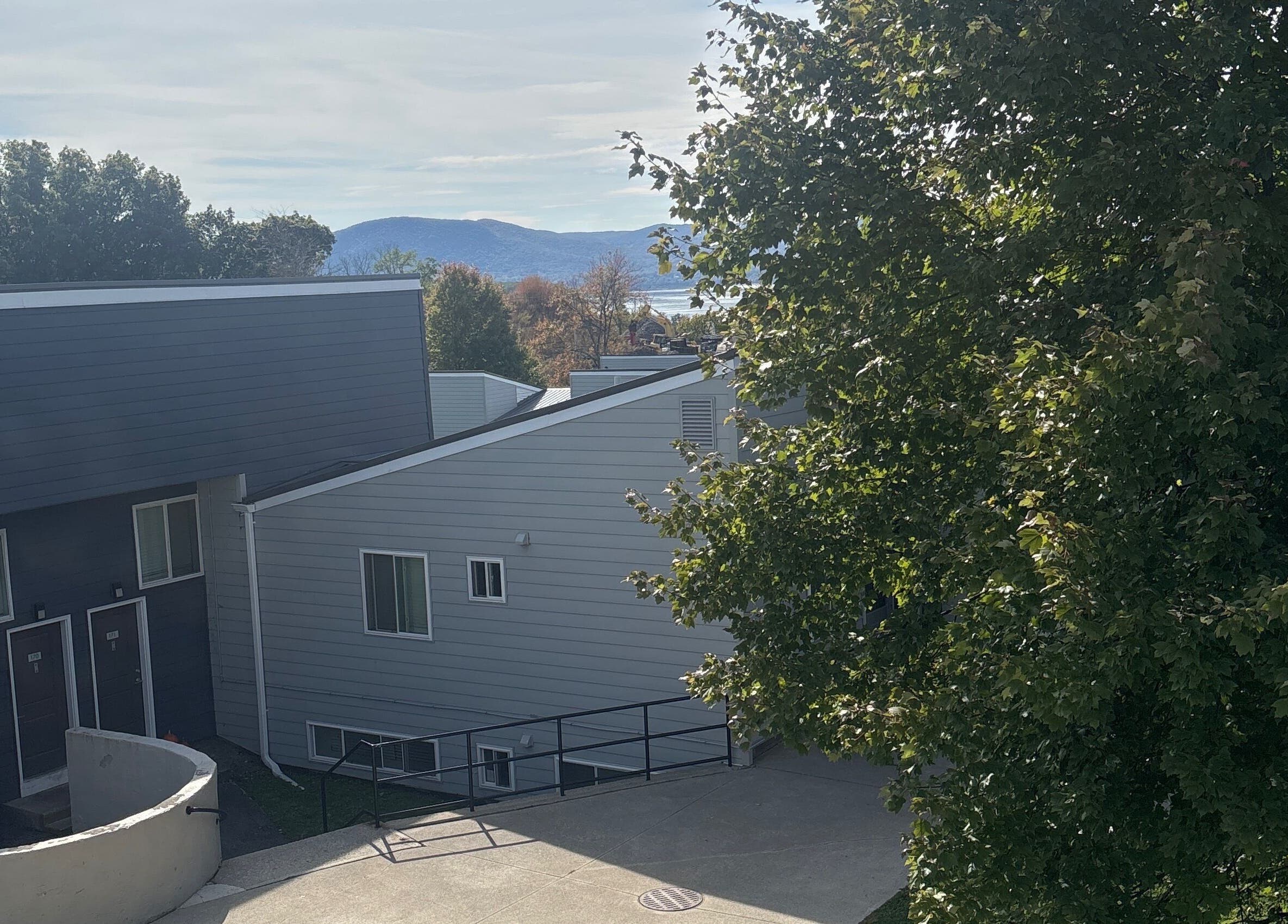 Exterior of Leschae Braids 2.0 in Beacon, New York, with scenic view and lush greenery.