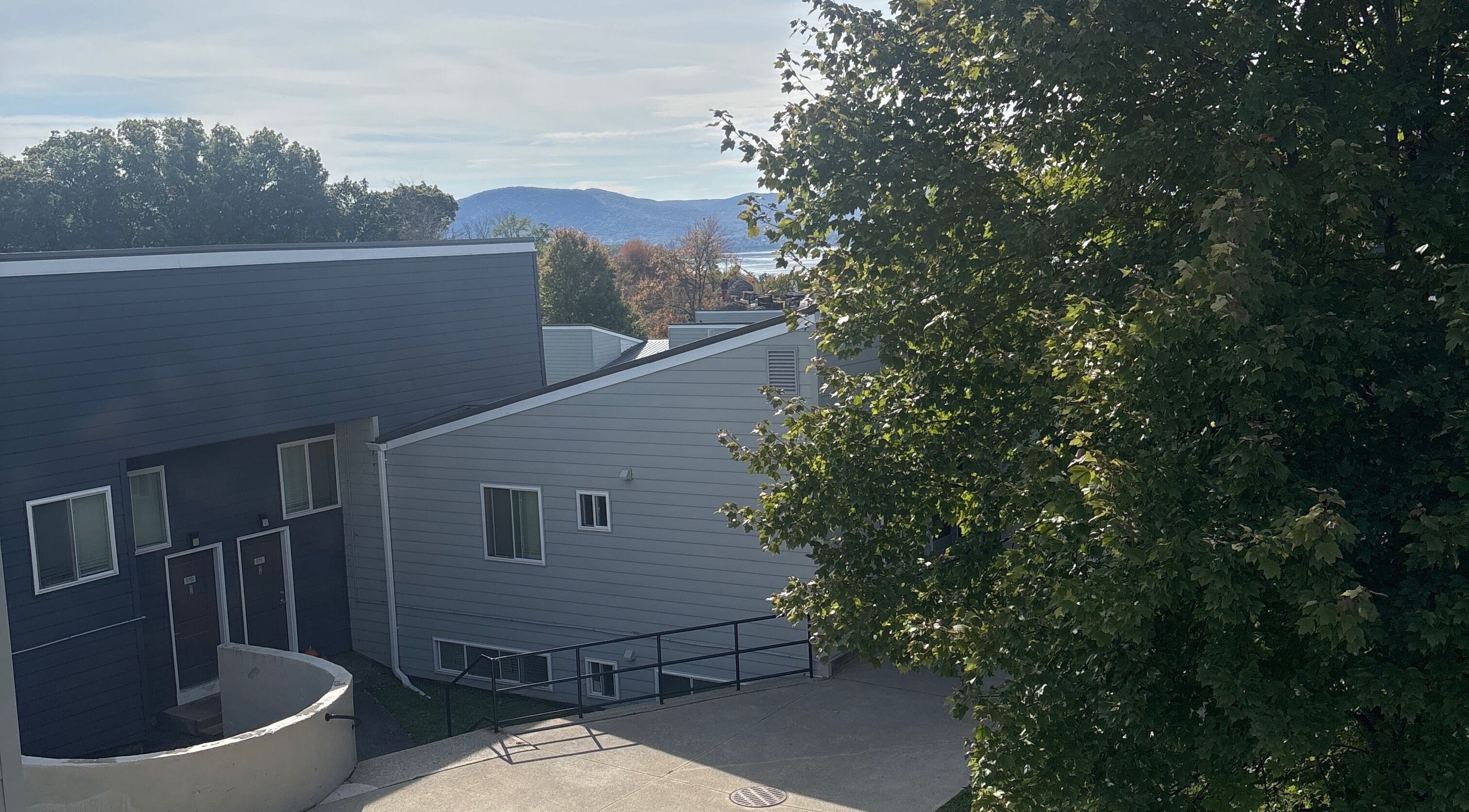 Exterior of Leschae Braids 2.0 in Beacon, New York, with scenic view and lush greenery.