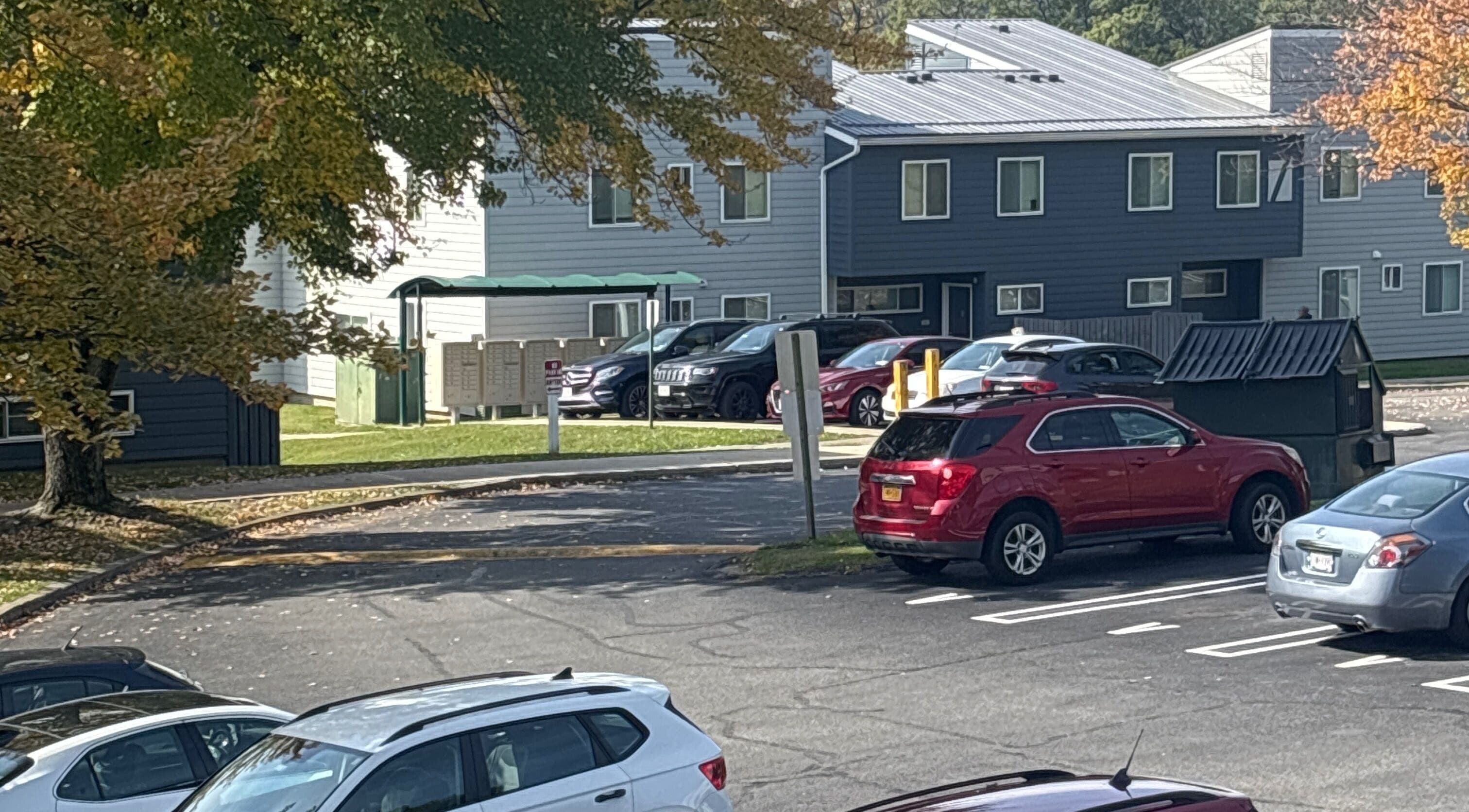 Scenic parking area with trees at Leschae Braids 2.0, Beacon, New York, US.