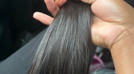 Smooth, glossy black hair held at JNS Hair Studio🎀 in Kabokweni, Mpumalanga, ZA showcasing silky texture.