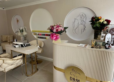 Luxurious interior of D&M Nails Salon in Bletchley, England, GB featuring chic decor and manicured settings.