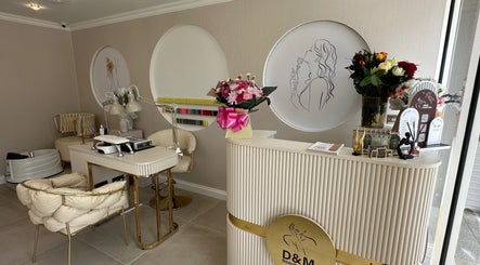 Luxurious interior of D&M Nails Salon in Bletchley, England, GB featuring chic decor and manicured settings.