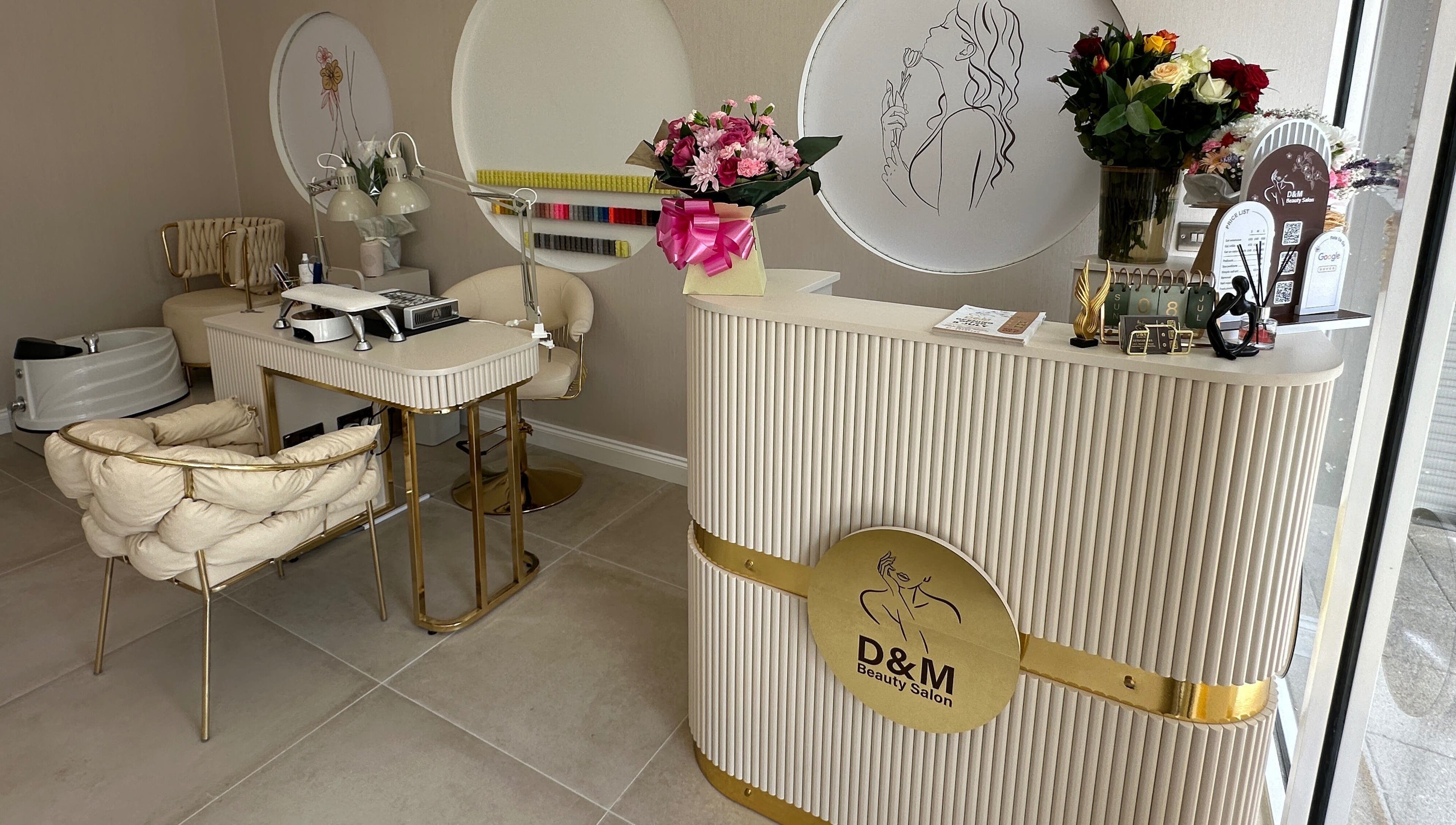 Elegant interior of D&M Nails Salon in Bletchley, England, GB showcasing chic decor and nail stations.