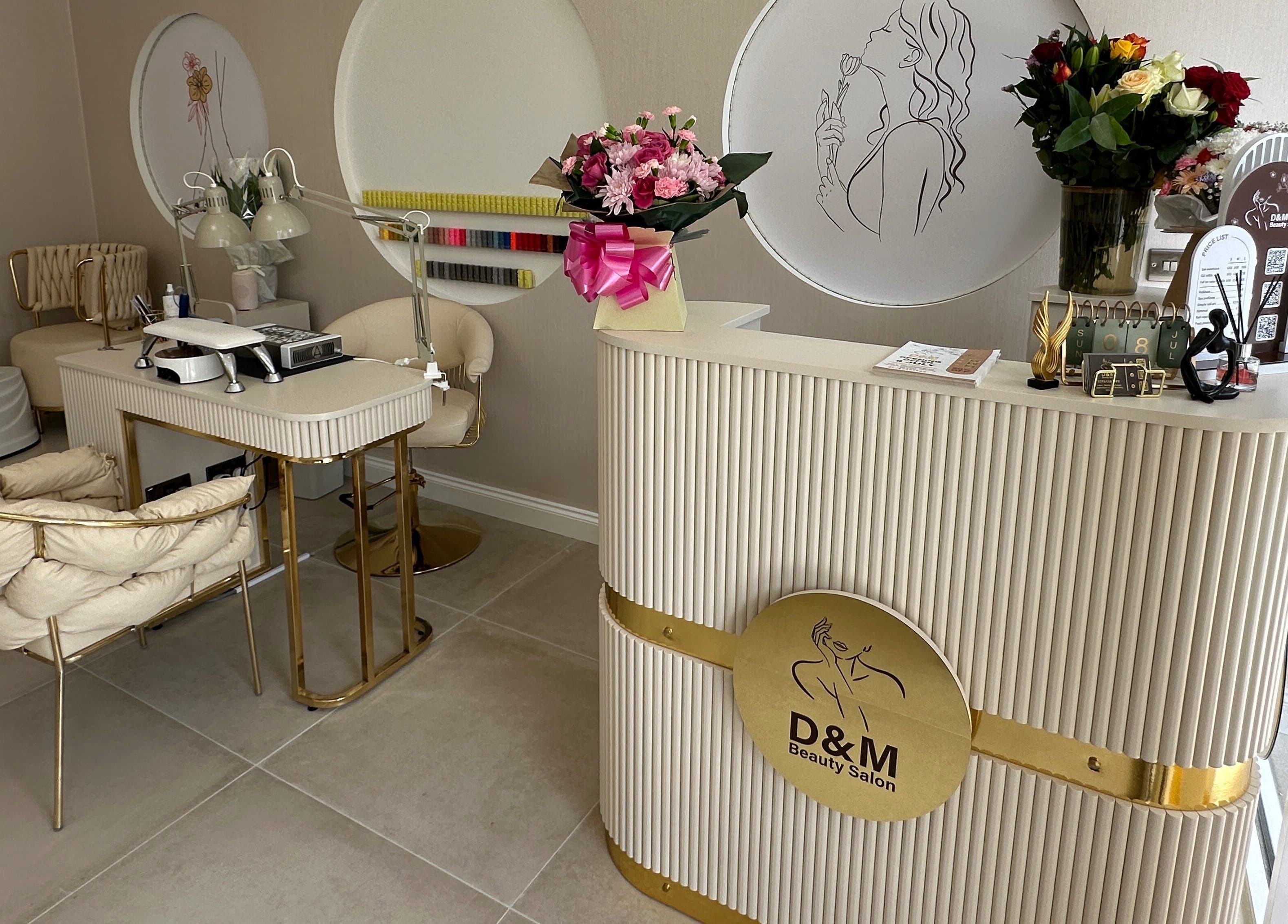 Elegant interior of D&M Nails Salon in Bletchley, England, GB showcasing chic decor and nail stations.