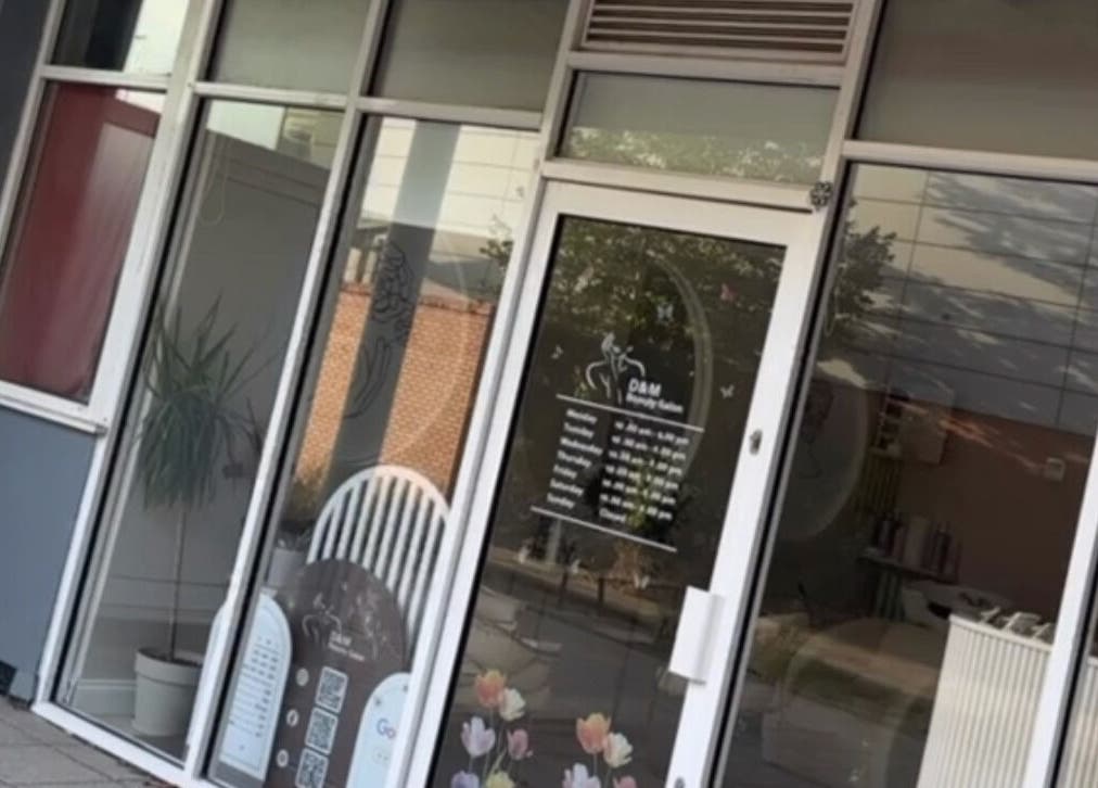 Front view of D&M Nails Salon in Bletchley, England, GB, showcasing modern glass entrance decor.