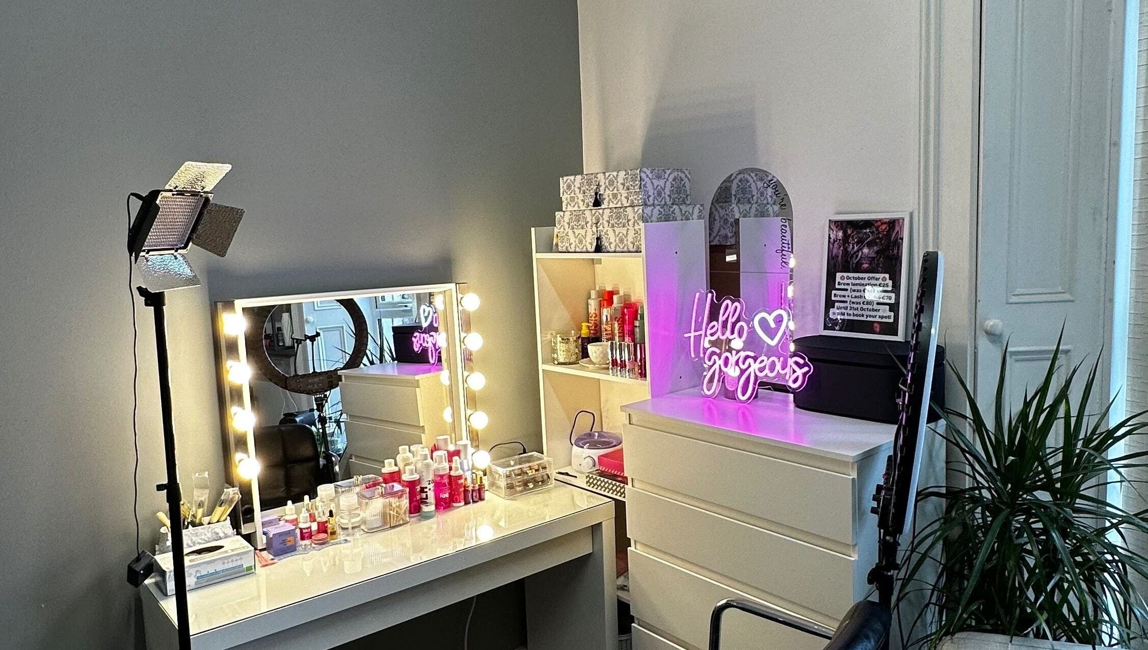 Glamorous beauty station at Alina Kotik, Mullingar, County Westmeath, IE, with illuminated mirror and neon sign.