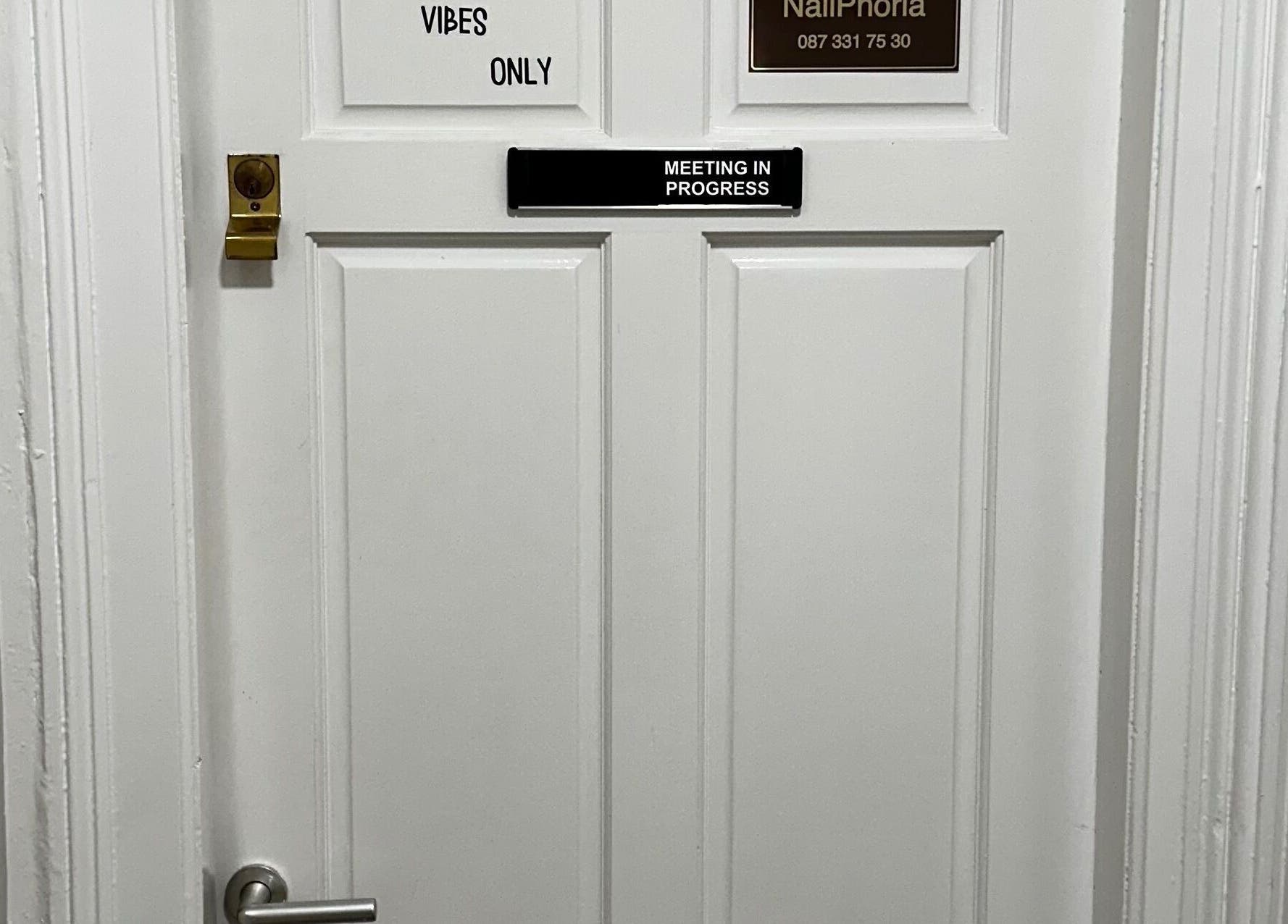 Entrance to Alina Kotik in Mullingar, County Westmeath, IE, with 'Vibes Only' sign.