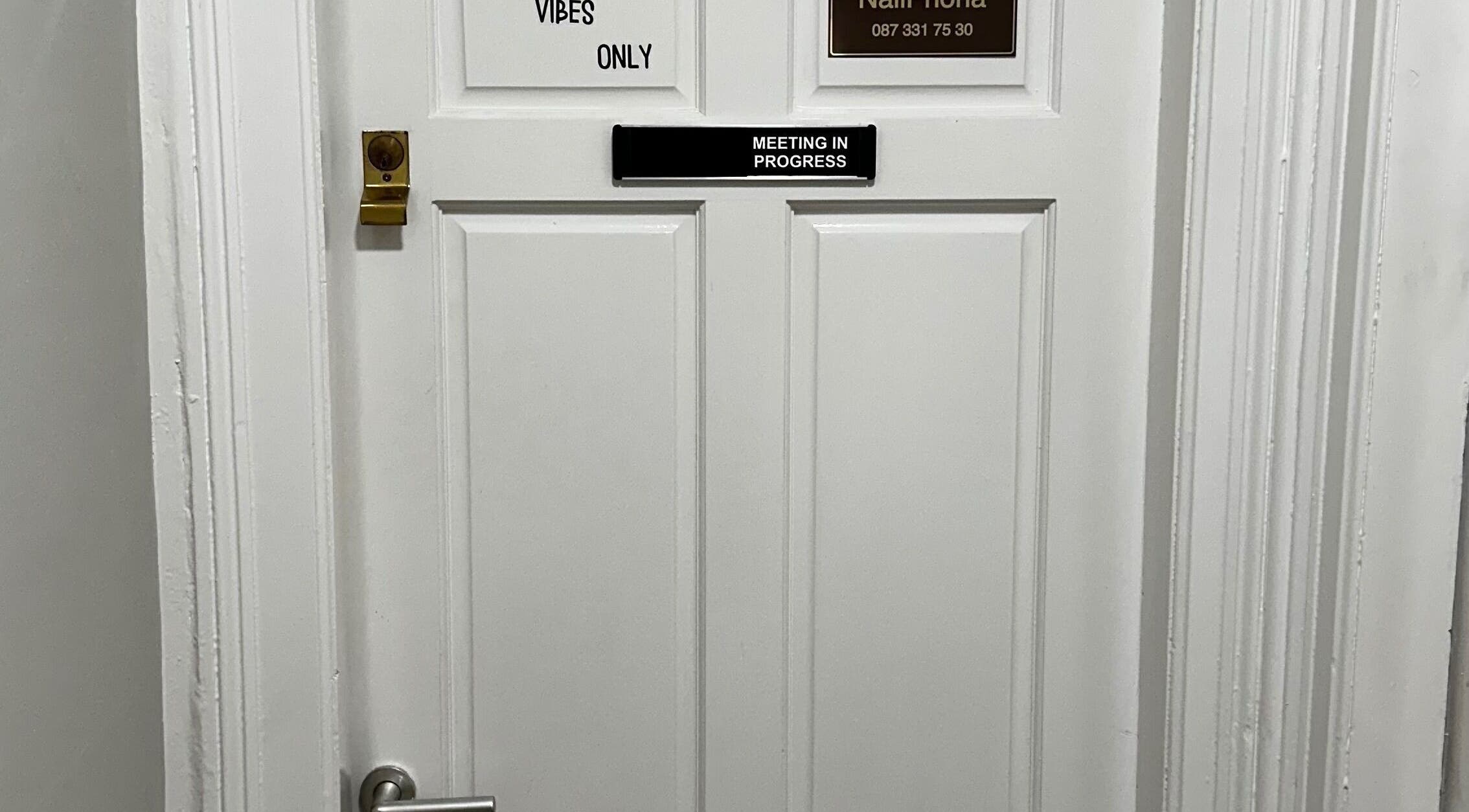 Entrance to Alina Kotik in Mullingar, County Westmeath, IE, with 'Vibes Only' sign.