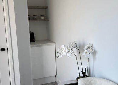 Elegant corner with white orchids at Honey Luxe Nails, Gosport, England, GB.