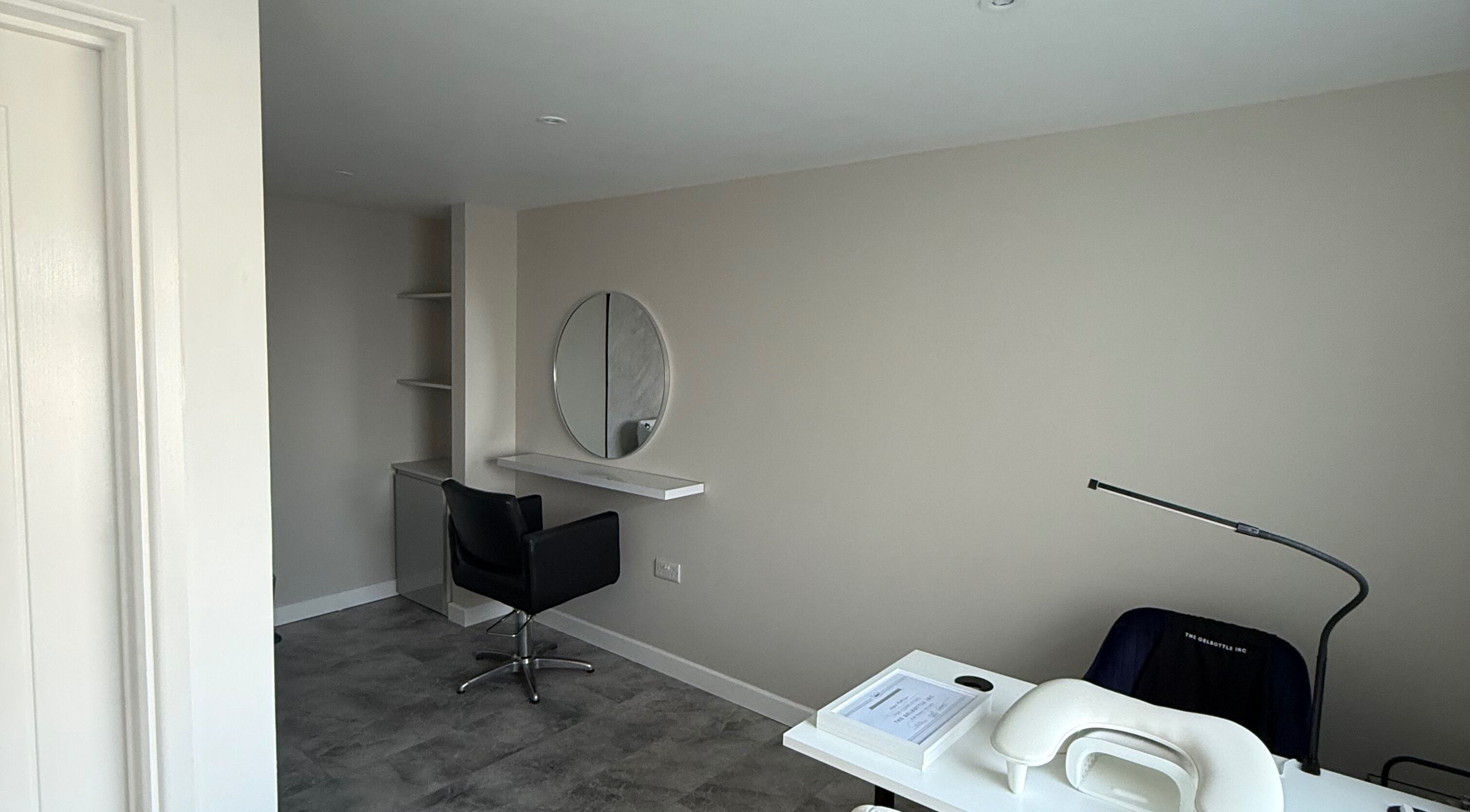 Modern salon space at Honey Luxe Nails in Gosport, England with sleek decor and professional styling chair.