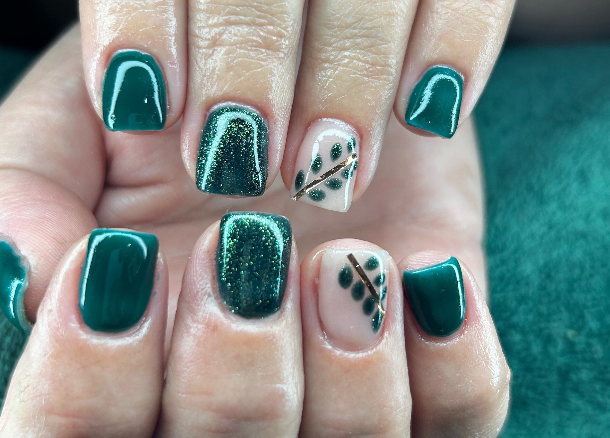 Elegant green nail art with leafy designs at Nicky’s Nails, Gqeberha, Eastern Cape, ZA.