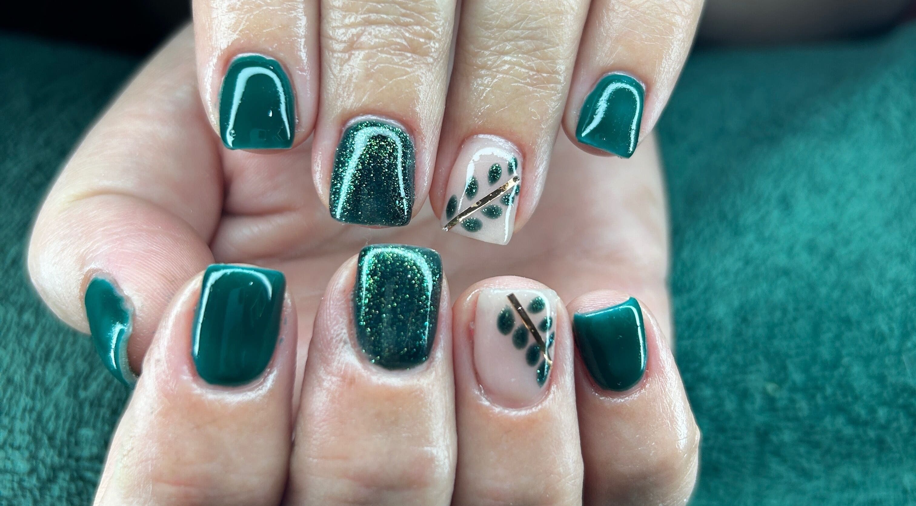 Elegant green nail art with leafy designs at Nicky’s Nails, Gqeberha, Eastern Cape, ZA.