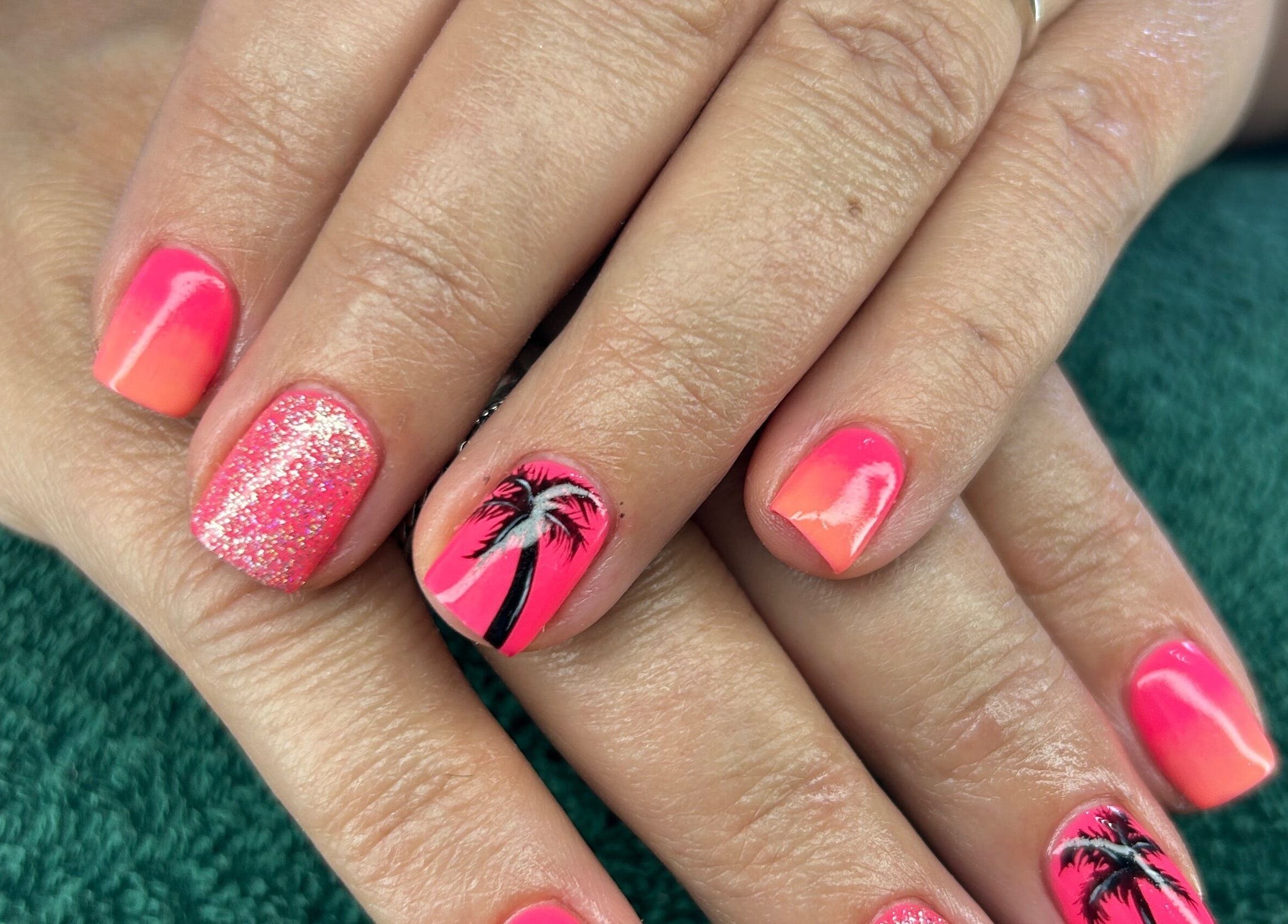 Bright pink and orange nails with palm tree design at Nicky’s Nails, Gqeberha, Eastern Cape, ZA.
