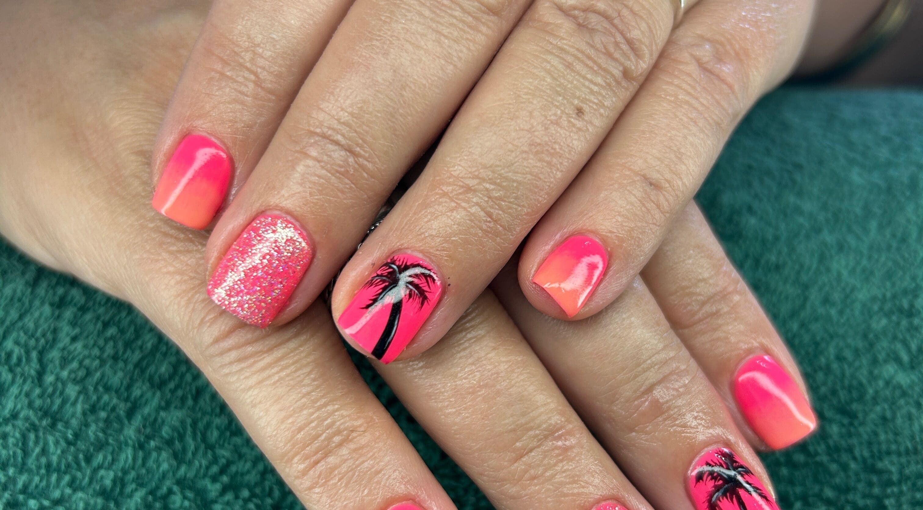Bright pink and orange nails with palm tree design at Nicky’s Nails, Gqeberha, Eastern Cape, ZA.