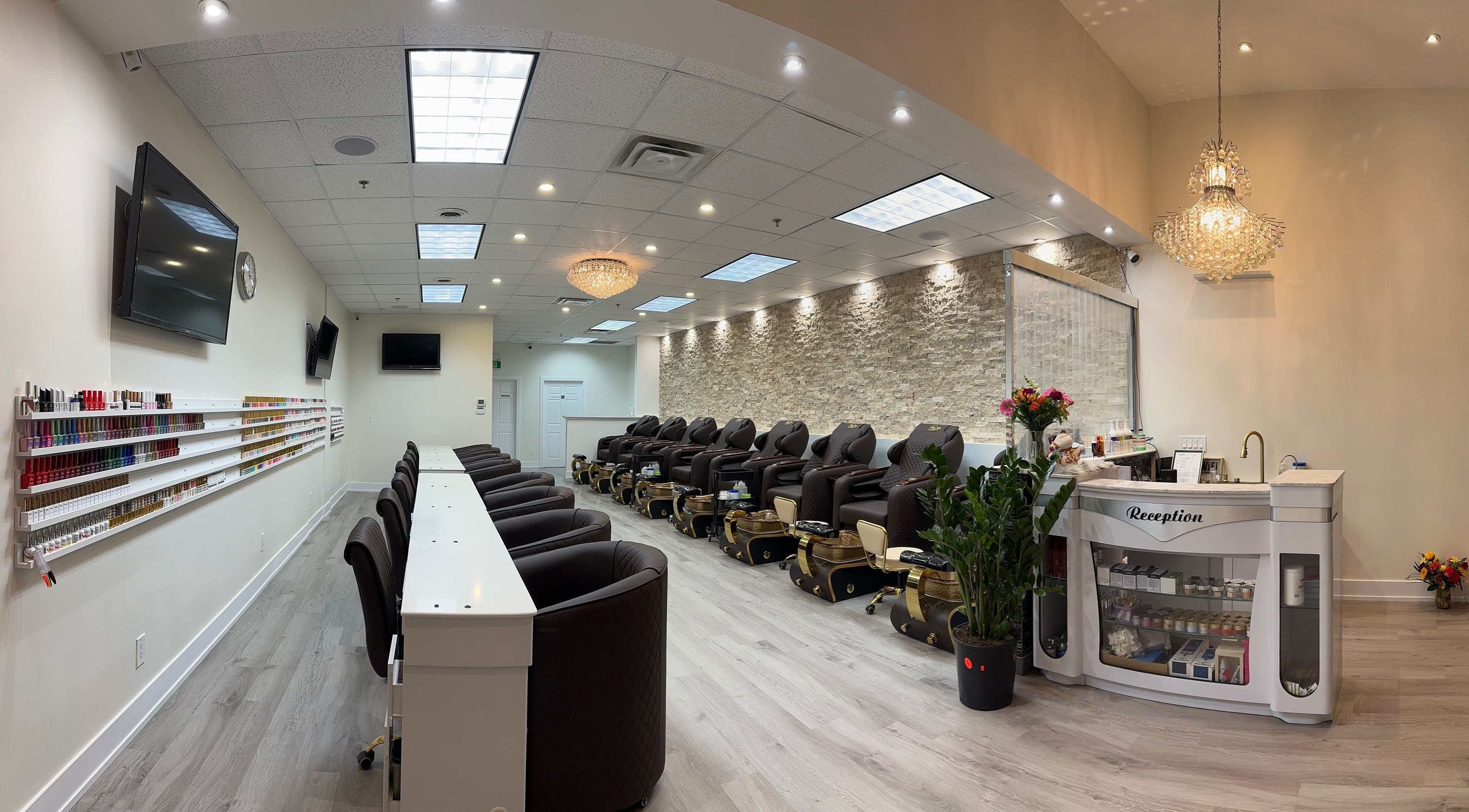 Elegant interior of Nails For You in Brampton, Ontario, CA with luxurious pedicure chairs and reception.