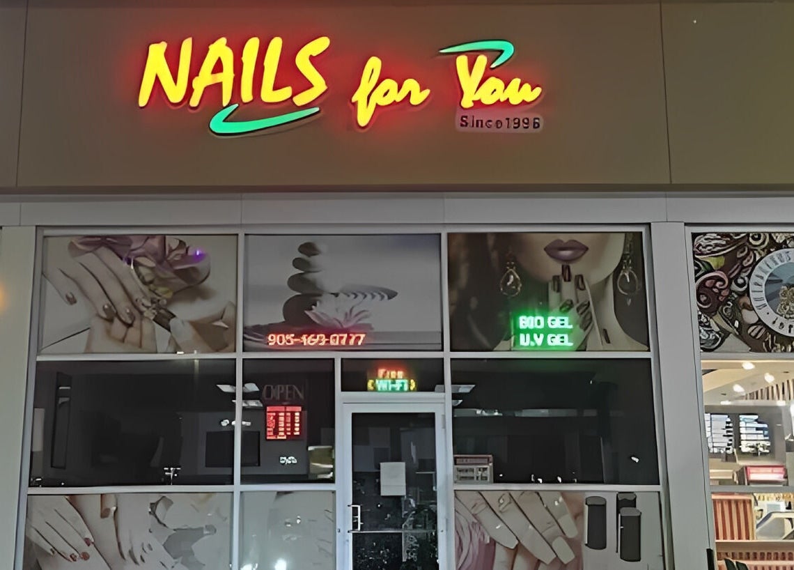 Front view of Nails For You salon in Brampton, Ontario, CA with vibrant signage and nail art posters.